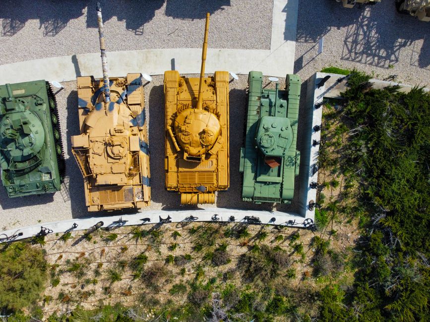 A display of military tactical gear, highlighting the modular Fighting Load Carrier (FLC) vest